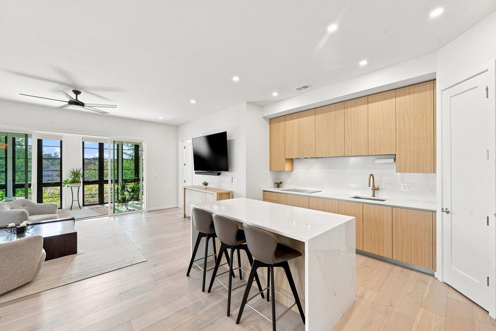 Open living and kitchen with high ceilings